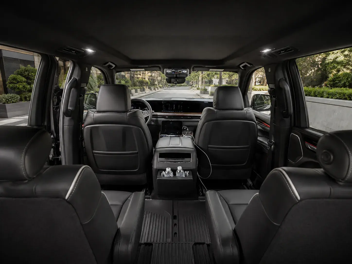 Escalade ESV cabin looking forward from the third row, past the second-row captain's chairs