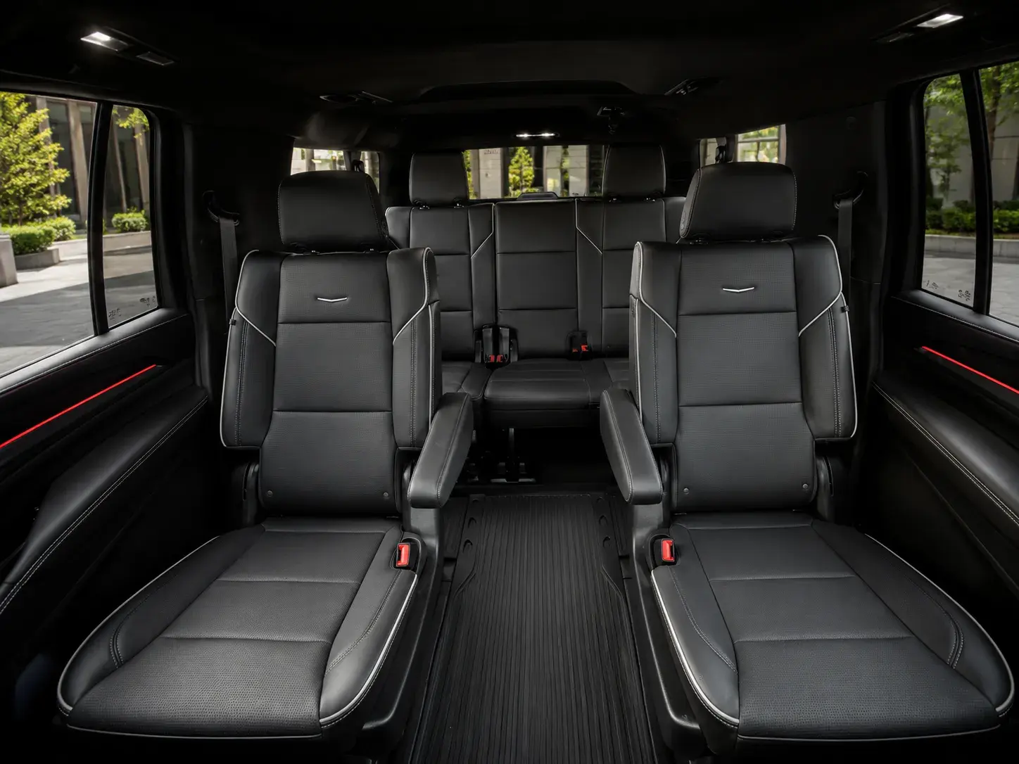 Second-row captain's chairs and the third-row bench inside the Escalade ESV