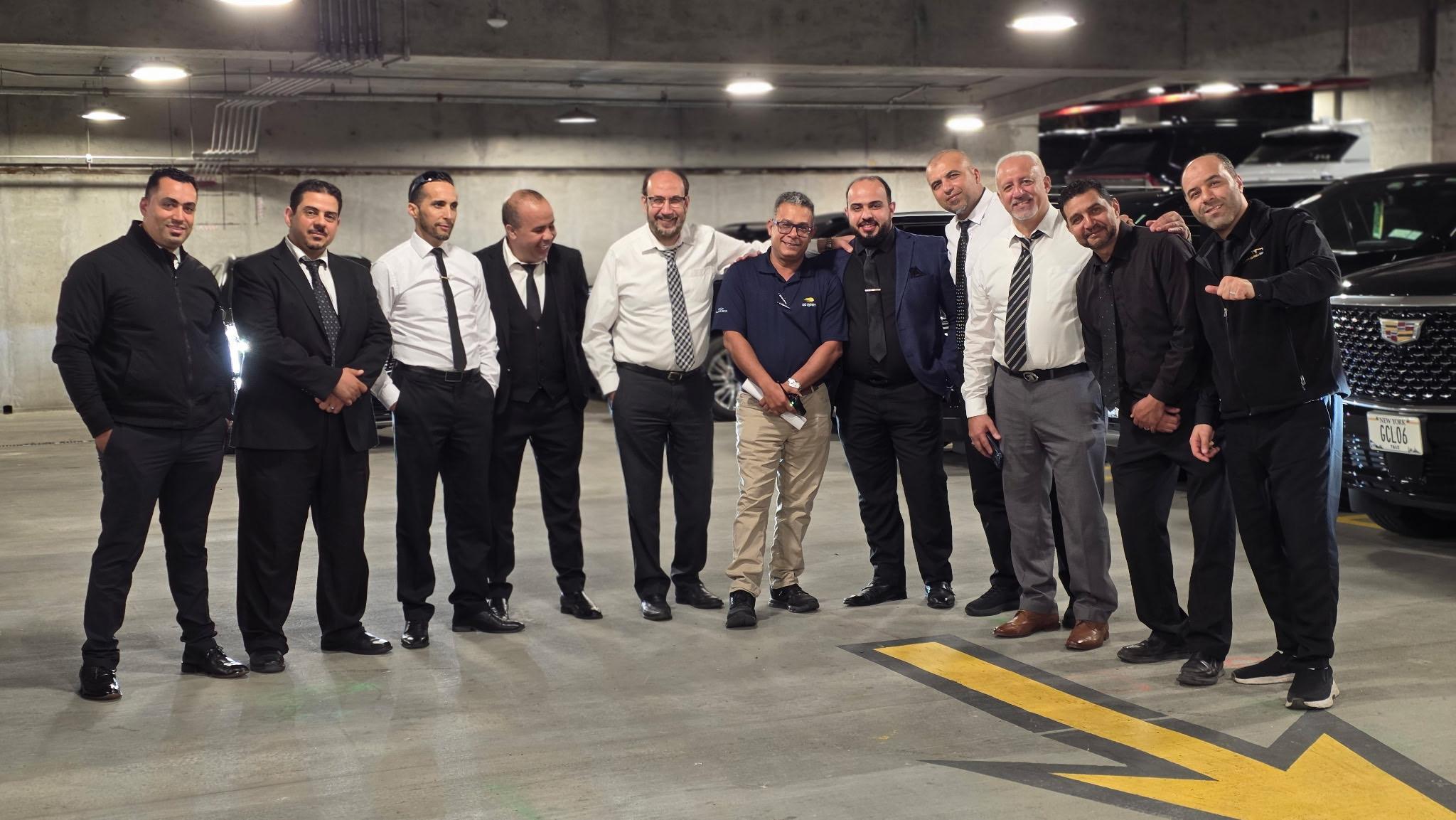 Golden Class Limo chauffeurs together in the garage with the fleet