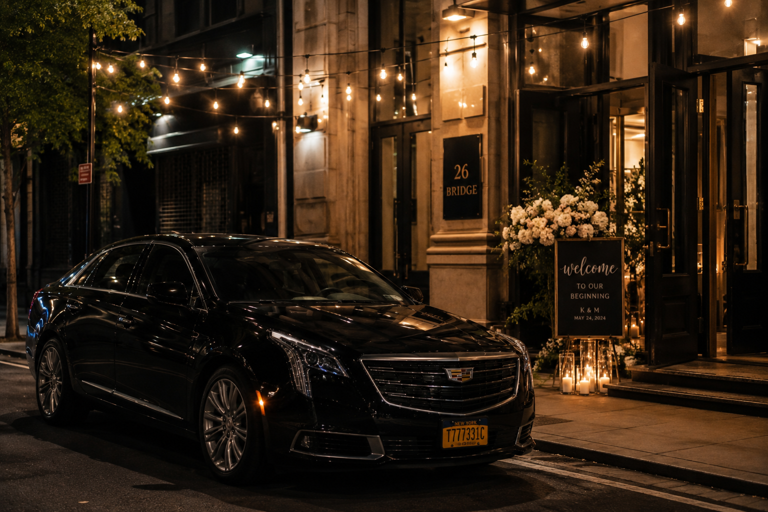 Wedding car parked outside a New York City reception venue at night